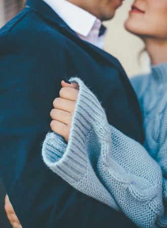 Tender couple share some warm hughs with each other, close up shotの写真素材