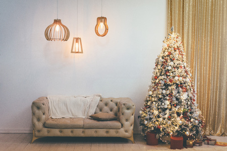 Christmas decorated interior of couch and Christmas tree, modern and cozyの写真素材