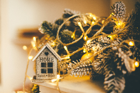 Athmospheric Christmas-related house decorations - lights and wooden homeの写真素材