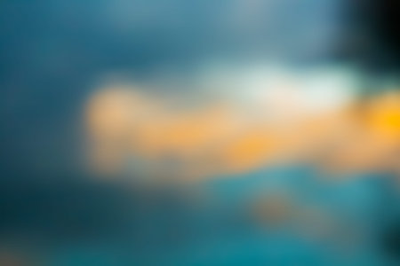 Abstract blurred background with blue and yellow bokeh