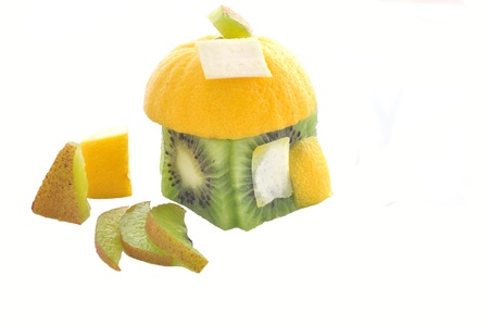 Fruity house made from kiwi and lemon peaces. Isolated on white, copy space on the roofの写真素材