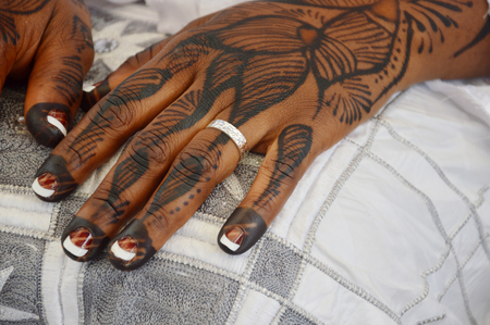 Tattoos done on the hands and feet of bride for an ethnic group in Ivory coast with 60 ethnic groups.のeditorial素材