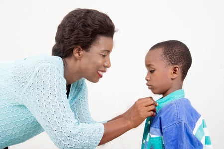 This smiling mother cares for her sound.の写真素材