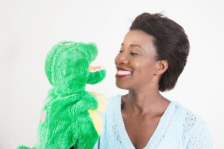 This draws attention to young woman to her child on the toy That Fits in the hand.の写真素材