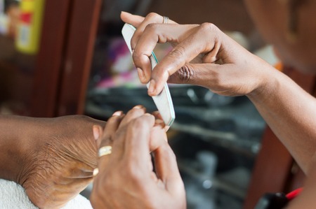 Pedicure Embodiment of a young woman at the beauty salon before Attending a ceremony.の写真素材