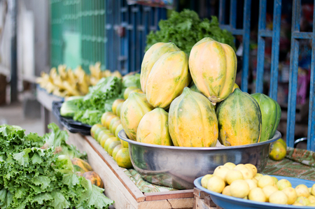 Fresh fruit and vegetables on shelves for health.の写真素材