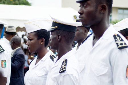 Abidjan, Ivory Coast - August 3, 2017: shoulder pad ceremony for students leaving the Maritime Academy. a group of young sailors dressed in blankets waiting for their diplomas.のeditorial素材