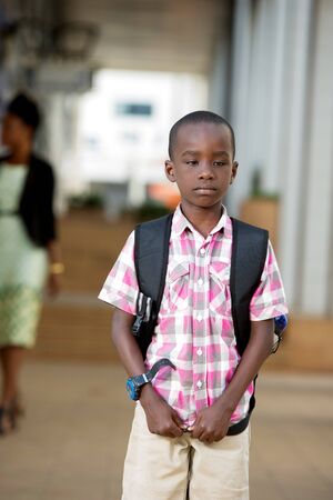little boy dissatisfied to go alone to school in the morning.の写真素材