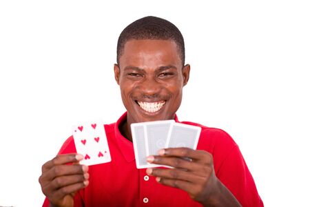smiling and funny man showing cards in his hands.and offers to play,close-up on the cards.の写真素材