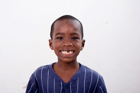 portrait of happy little african boy isolated on white background