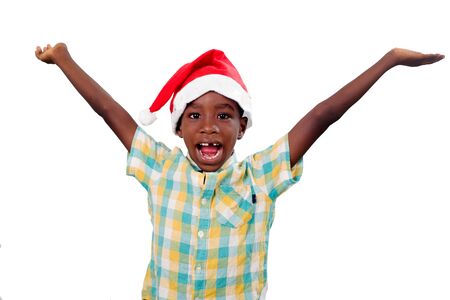 portrait of little happy boy wearing a Santa Claus hat isolated on white background.の写真素材