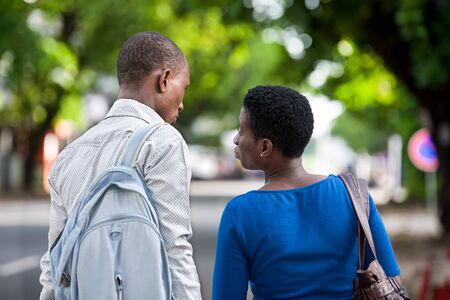 Young people standing in street giving back to the camera.の写真素材