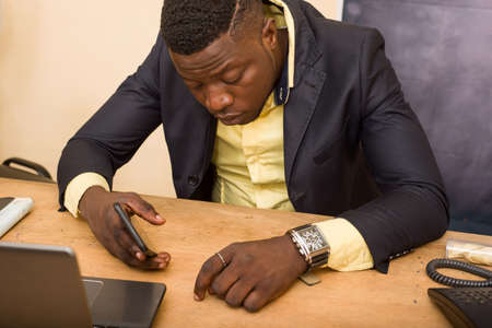 young man sitting in office suit, sleeping.の写真素材