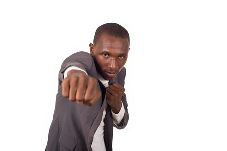 Portrait of smiling young man in suit standing on white background doing box.