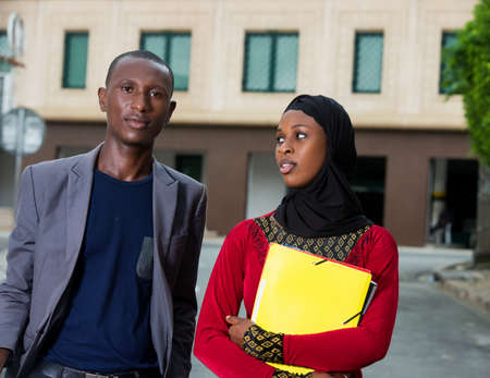 colleagues walking on the street talking.の写真素材