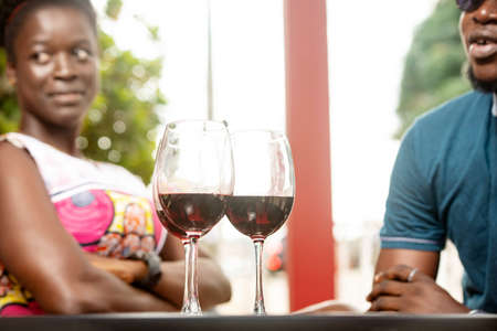 a group of friends sitting in a bar celebrating an event.の写真素材