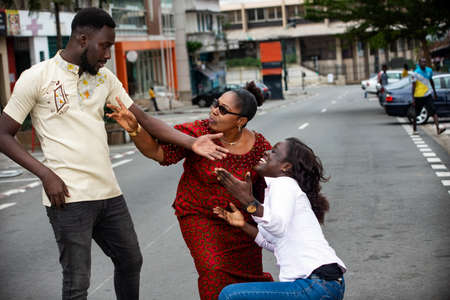 group of people standing in the middle making scenes of theater while smiling.の写真素材
