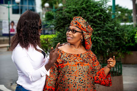 a charming family walking in the street talking to each other.の写真素材