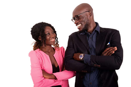 beautiful young couple in love with a happy face and looking at each other crossing arms. isolated on white backgroundの写真素材