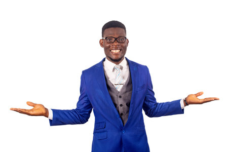 a handsome businessman in a suit standing on a white background hands outstretched smilingの写真素材