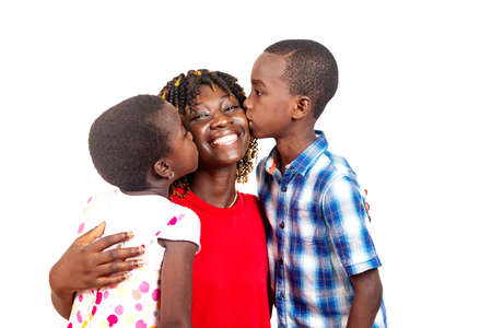 Children kissing mother on white background.の写真素材