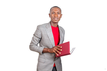 portrait handsome adult businessman holding a book and smiling at the camera.