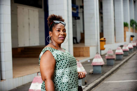 beautiful mature business woman standing on the street looking at camera.の写真素材