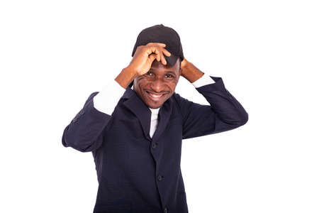 adult businessman wearing a black hat on his head and smiling at the camera.の写真素材