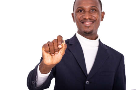 handsome happy adult businessman holding and giving a key and smiling at the camera.の写真素材