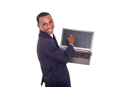 happy adult businessman holding and pointing his finger on the laptop screen and smiling at the camera.の写真素材