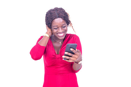 beautiful happy young woman using a cellphone smiling.の写真素材