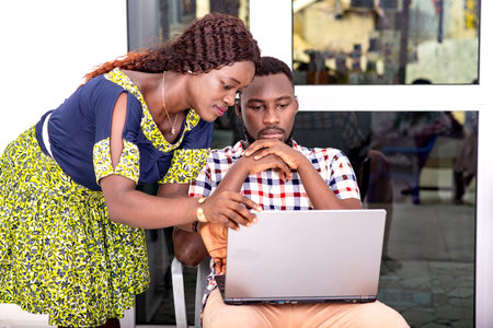 young home business couple working using laptop.の写真素材