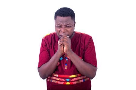 handsome young man, wearing a red shirt, afraid, and crossing his hands over his mouth.の写真素材