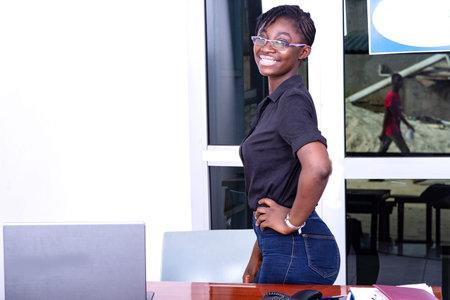 beautiful young businesswoman smiling looking at the camera in the office.