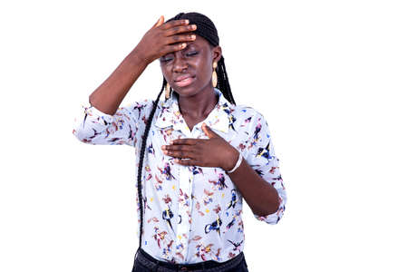 portrait of a beautiful young ill woman suffering from a headache.の写真素材