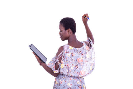 portrait of the young teacher using a digital tablet writing on a whiteboard.の写真素材