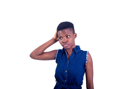 portrait of a beautiful girl with hand on head looking to the side.の写真素材