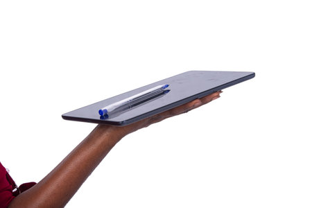 a female hand holding a tablet on a white background with pen.
