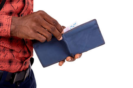 photo of hands of a young man taking money banknote from his wallet.の写真素材