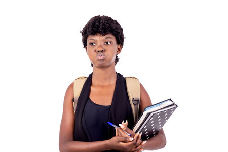 young student girl carrying a backpack and puffing up her cheeks.