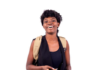 portrait of a happy student girl carrying a backpack while smiling at the camera.の写真素材