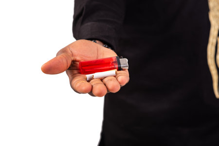 male hand on white background holding cigarette and lighter