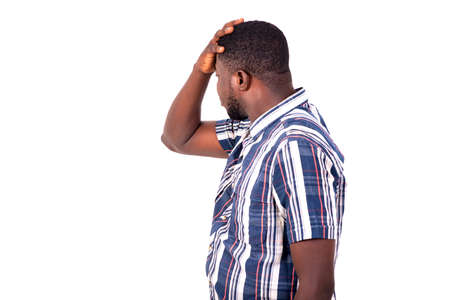 portrait of a desperate handsome young man holding hand on his head.の写真素材