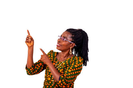 portrait of a beautiful adult woman wearing traditional loincloth and pointing fingers up while smiling.の写真素材