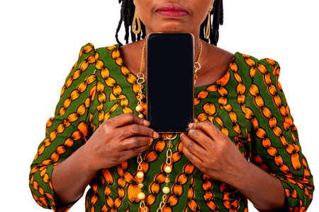 portrait of a beautiful adult woman dressed in traditional loincloth showing a mobile phone.の写真素材