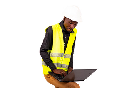 portrait of a concentrated young man architect working with a laptop.