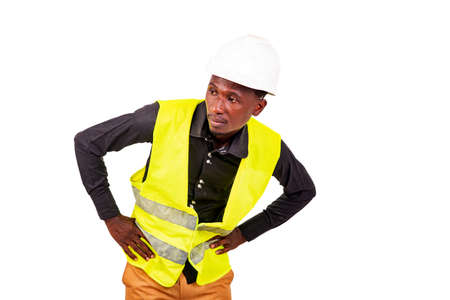 young man engineer wearing green vest and white safety helmet while looking aside.の写真素材