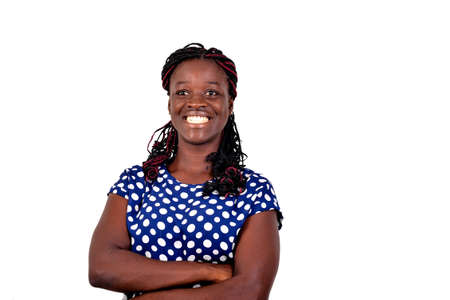 portrait of a beautiful happy young woman crossing her arms while smiling. isolated on white background.の写真素材