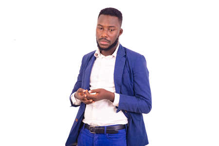 portrait of a handsome young businessman wearing an elegant suit gesturing his hands.の写真素材