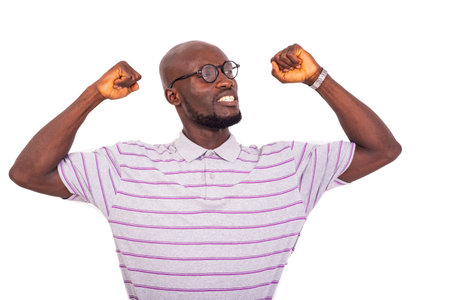 young business man wearing his glasses and showing his biceps while smiling.